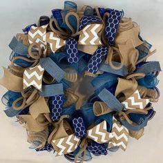 a blue and white wreath with burlucks on it