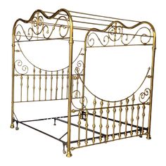 a gold metal bed frame with ornate designs