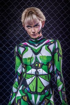 a woman with green hair wearing a bodysuit made out of geometric shapes and lines