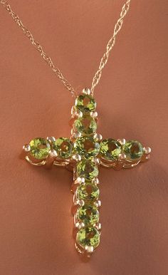 1.20 Carat Natural Green Peridot 14K Solid Yellow Gold Cross Pendant with Chain Amazing looking piece! Suggested Replacement Value: Approx. $1600.00 Total Natural Round Cut Green Peridots Weight: 1.20 Carat Chain Length is: 16 inches Pendant measures: Approx. 25 x 18.4mm Total item weight is: Approx. 2.1g Disclaimer: all weights, measurements and colors are approximate and may vary slightly from the listed dimensions or as seen in the image. All pictures are magnified to show the smallest of det Fine Jewelry Lime Green Gemstone, Luxury Yellow Gold Peridot Jewelry, Yellow Gold Jewelry With Polished Tsavorite, Formal Peridot Gemstone Necklaces, Yellow Gold Peridot Gemstone Jewelry, Luxury Peridot Jewelry For Gifts, Green Pendant Gemstones For Formal Occasions, Fine Jewelry Peridot For Formal Occasion, Formal Fine Jewelry With Peridot