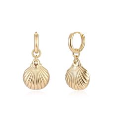 a pair of gold earrings with a shell charm on the front and back of each ear