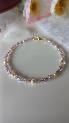 Sparkling bracelet with river micropearls, gold Toho pearls and lilac Swarovski. Adjustable! Extremely long-lasting, hypoallergenic 24k gold-plated components. Perfect to combine with a lilac dress for a special event! Would you like to have the necklace and earrings too? Send me a message! He knows Elegant Purple Crystal Bracelet With Spacer Beads, Gold Pearl Crystal Bracelet With Round Beads, Elegant Beaded Lavender Bracelets, Elegant Hypoallergenic Purple Beaded Bracelets, Elegant Lavender Beaded Bracelets, Elegant Lavender Beaded Bracelet, Elegant Gold Crystal Bracelet With Spacer Beads, Elegant Lavender Crystal Bracelet With Round Beads, Elegant Purple Jewelry With Gold Beads