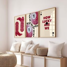 three framed art pieces hang on the wall above a bench in a room with white walls