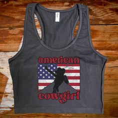 Crafted From 100% Cotton, This Top Is Both Comfortable And Breathable, Making It Perfect For Those Hot Summer Days. The Cropped Silhouette Is On-Trend And Flattering, While The Classic Western Design Elements Add A Touch Of Rustic Charm. American Flag Print Cotton Tank Top, Fitted American Flag Print Cotton Tops, American Cowgirl, Rodeo Girls, Faster Horses, Black Cropped Tank, Black Crop Top Tank, Western Design, Festival Tops