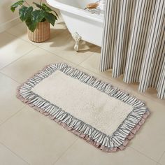 Vendor: April & Olive Type: Bathmat Price: 49.95 Step out of the shower and into cozy country farmhouse bliss. The Kaila Bath Mat 27x48 features a solid creme core in premium, ultra absorbent cotton. It is trimmed with a ruffled vintage striped fabric in navy blue and creme layered over a vintage floral in misty rose. Backed with textured rubber to produce a quality, non-slip surface without the need for a separate rug pad. This ruffled bath mat is a great finishing piece for… Farmhouse Bath Mat, Primitive Colors, Vintage Colour Palette, Blue Bath Mat, Vhc Brands, Rose Care, Blue Bath, Misty Rose, Boho Room