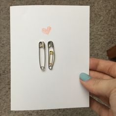 a pair of scissors sitting on top of a piece of paper