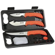 two orange handled knifes in a black case with white and gray items inside it