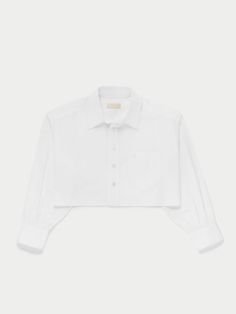 Versatile Leuka shirt with a crop finish makes throw-it-on style easy. Wear it as a jacket or as a simple crop shirt. | Suzie Kondi Leuka Cropped Button-Up in Cotton Poplin | White | Women's X-Small White Cropped Shirt For Fall, Classic Cropped Blouse For Daywear, Classic Cropped Shirt, Cropped Button Shirt For Daywear, Relaxed Fit Cropped Shirt With Buttons, Cropped Button Shirt For Work, Classic Cropped Summer Shirt, Classic Cropped Shirt For Spring, Classic Long Sleeve Cropped Shirt For Summer