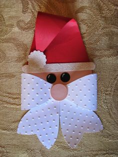 an origami santa claus made out of paper