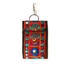 a red purse with colorful beads hanging from it's front end and a metal hook in the middle