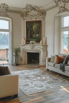 a living room with two couches and a fire place in it's center