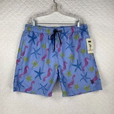 Add A Touch Of Vibrant Style To Your Beach And Poolside Collection With These Us Polo Assn Seahorse Starfish Men's Shorts Swim Trunks In Size Xl And Blue Color. Crafted From Breathable Polyester Material, These Trunks Feature A Drawstring Closure For A Perfect Custom Fit. The Lining Is Made Of Soft Polyester That Ensures Comfort For All-Day Wear. These Swim Trunks Are Perfect For Various Activities Like Training, Surfing, And Recreational Sports. They Come With The Features Of Being Lined, Draws Casual Blue Swim Trunks With Built-in Shorts, Casual Blue Relaxed Fit Swim Trunks, Light Blue Casual Short Swimwear, Blue Relaxed Fit Bottoms For Pool, Blue Casual Swim Trunks For Beach Season, Casual Blue Swim Trunks For Beach, Casual Blue Swimwear With Relaxed Fit, Casual Blue Swimwear, Blue Relaxed Fit Swim Trunks For Summer