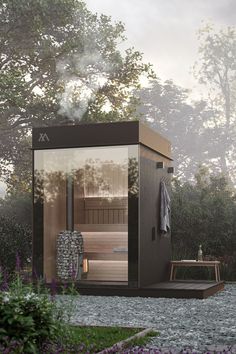 an outdoor sauna in the middle of a garden