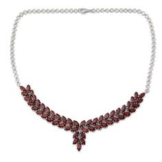 Alok Jain of India presents a garnet necklace that is truly worthy of royalty. He sets a stunning 25 carats of the faceted crimson stones in gleaming rhodium plated sterling silver and suspends the pendant from a classic silver rolo chain. The result is a breathtaking statement necklace.Rhodium plated .925 sterling silver Luxury Red Sterling Silver Necklace, Fine Garnet Necklace As Gift, Fine Garnet Necklace For Gift, Fine Jewelry Garnet Necklace As Gift, Elegant Red Faceted Necklace, Elegant Red Garnet Necklaces, Wedding Garnet Pendant Jewelry, Red Faceted Jewelry For Formal Occasions, Elegant Red Garnet Necklace