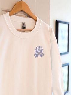 Our monogram sweatshirt makes a great, cozy gift for mom or as a comfy gift for brides and bridesmaids. Our sweatshirts feature an embroidered custom monogram in 3 sweatshirt colors ranging from sizes small to 5XL (Sand only available up to 3XL). Customize this comfy gift with the monogram and thread color of your choice.  ✨ Sample  - White Sweatshirt - Willa Monogram - Hydrangea Thread Color (Not on the thread chart; For this thread option just add to personalization box) ✨ Please Note: All our sweatshirts are embroidered not printed! ✨ Available in 3 colors - White, Sand & Black ✨ Heavy Blend Fleece - 50% Cotton/50%Polyester ✨ Available in sizes S-5XL (Sand only Available to 3XL). See Photos for Size Charts. ✨ Do you need your order sooner than our current production time? Click the link Monogrammed Sweatshirt, Monogram Sweatshirt, Wedding Wonderland, Embroidered Initials, Embroidery Monogram, Sweatshirt For Women, Cozy Gift, Custom Sweatshirts, Monogram Gifts