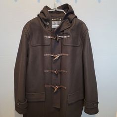 New With Tags Attached, Never Worn, Has Attached Hood, 2 Exterior Pockets And 1 Interior Pocket. Has Toggle Exterior Closures. Mens Extra Large Id Number F85238 Originally Bought For $789.00 Classic Fall Outerwear With Toggle Closure, Wool Outerwear With Toggle Closure For Work, Fall Outerwear With Toggle Closure For Cold Weather, Winter Outerwear With Toggle Closure For Cold Weather, Hooded Outerwear With Toggle Closure For Work, Long Sleeve Outerwear With Toggle Closure For Work, Designer Long Coat For Fall, Classic Winter Outerwear With Toggle Closure, Winter Wool Outerwear With Toggle Closure