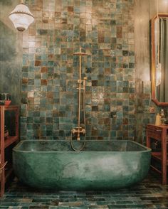 a bath tub sitting in the middle of a bathroom