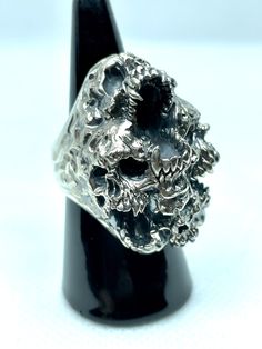 Jewel made entirely by hand by the Italian craftsman Gianmarco Fontana. Ring made of 925 Silver, which is part of the "SKULLS" collection depicting Paranoia. This ring represents the transformation and progression of Paranoia. Psychosis characterized by the development of a chronic, coherent delusion, which evolves slowly, leaving the remaining psychic functions intact. Luxury Silver Skull Ring For Formal Occasions, Carved Sterling Silver Skull Ring, Carved Sterling Silver Skull Ring For Gift, Unique Sterling Silver Skull Ring With Polished Finish, Unique Silver Skull Ring Collectible, Silver Skull Ring With Polished Finish For Formal Occasions, Luxury Jewelry With Lost Wax Casting, Formal Silver Skull Ring With Polished Finish, Unique Silver Skull Ring Hallmarked