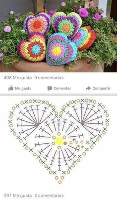 a crocheted heart sitting on top of a pot filled with flowers