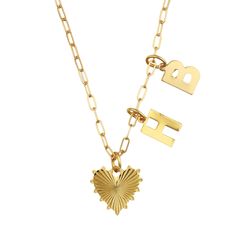 When you think Hart, think joyful jewelry. Created by Charlestonian Hart Hagerty in 2016, each piece of HART is a talisman to positivity, creating a soul-boosting experience for the modern, mindful woman. The Personalized Baby Heart of Gold & Initials Necklace is a statement piece that is all about you. Choose up to three initials and layer them together on the gold-filled heirloom chain for a unique and elegant look. We love this necklace as a gift for mom—perhaps with baby’s initials. Product Gold Heart Charm Necklace, Initial Charm Necklace, Liz Adams, Heart Cross Necklace, Initials Necklace, Baby Heart, Custom Charm Necklaces, Puffy Heart Charms, Heart Charm Necklace