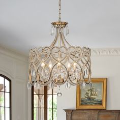 a chandelier hanging from the ceiling in a living room