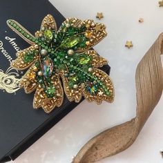 a brooch sitting on top of a book