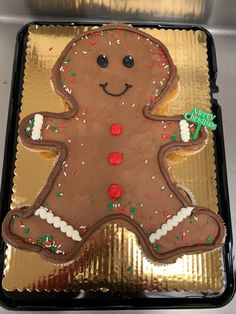 there is a large gingerbread decorated with icing and sprinkles on it