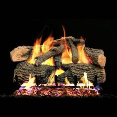 a fireplace with logs and flames in it