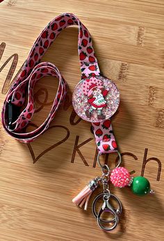 "Strawberry Girl Lanyard * These lanyards make the perfect gift for anyone! *Featured: 2\" Acrylic Is decorated with high quality polyester glitter. *Each charm is made with a 2\" Acrylic piece that is decorated and sealed.  *It is finished off with matching beads. (PLEASE NOTE: BEAD COLOR IS SUBJECT TO AVAILABILITY BUT WILL BE MATCHED TO THEME) *All Products are Handmade * WANT A CUSTOM LANYARD?! SEND ME A MESSAGE! CARE INSTRUCTIONS All items are made with high quality material but are not indestructible. Do NOT leave in extreme heat, drop on hard surfaces, soak in water or use harsh chemicals. These make great gifts! (Teachers gifts, Nurse gifts, coworkers' gifts, stocking stuffers and MORE **Please note this product contains small parts which may pose a choking hazard. DO NOT leave chil Gifts Coworkers, Coworkers Gifts, Strawberry Girl, Custom Lanyards, Teachers Gifts, Extreme Heat, Badge Holders Lanyard, Leave In, In Water