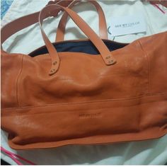 See By Chloe Shoulder Bag Nwot. Burnt Orange In Color. Can Be A Satchel Or Shoulder Bag. It Has 2 Shorter Strap Handles And Another Attached Longer Strap . Comes With Authenticity Card And Dust Bag. Designer Leather Duffle Bag For Shopping, Rectangular Duffle Bag With Leather Handles For Shopping, Designer Leather Duffle Bag With Large Capacity, Designer Double Handle Duffle Bag For Everyday, Modern Leather Duffle Bag With Handles, Leather Travel Bag For On-the-go, Leather Top Handle Duffle Bag For Shopping, Leather Shoulder Travel Bag With Handles, Modern Leather Duffle Bag For Shopping