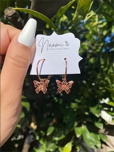 Description:Rose Gold Butterfly Earrings Specifications:Pendant Size: 12 mmWeight: 2.8 g/pairMaterial: Copper, 18k rose goldColors: rose gold "Flutter into style with these trendy Rose Gold Butterfly Earrings. Add a touch of whimsy to any outfit with 🦋, the perfect accessory for any occasion. Embrace your playful side and buzz into fashion with these must-have earrings." Rose Gold Adjustable Jewelry With Butterfly Charm, Adjustable Rose Gold Jewelry With Butterfly Charm, Rose Gold Butterfly Charm Earrings As Gift, Rose Gold Butterfly Charm Earrings For Gift, Rose Gold Earrings With Butterfly Charm As Gift, Nickel Free Rose Gold Hoop Earrings For Gift, Rose Gold Nickel-free Hoop Earrings As Gift, Nickel-free Rose Gold Hoop Earrings For Gift, Rose Gold Pierced Hoop Earrings As Gift