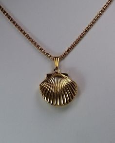 Gold Plated Seashell Locket Clam shell Locket is 25mm x 20mm in size strung on a 2mm wide 60cm / 23.6 inches long gold plated stainless steel high quality rounded BOX chain Small enough for a lock of hair or other keepsake memento. WE DO NOT PRINT THE PICTURE You will fill this locket at home. ☆ Complimentary Eco-     Gift Packaging      Ready for Gifting! ☆ Ships same day as ordered to USA only.  ☆ NO RETURNS OR EXCHANGES       ACCEPTED ON THIS ITEM.  ☆ Be HAPPY as a CLAM! Vintage Gold Shell As Gift, Vintage Gold Shell As A Gift, Vintage Gold Shell Gift, Vintage Shell Jewelry For Gift, Vintage Shell Jewelry For Gifts, Vintage Shell For Gift, Vintage Shell Gift, Seashell Locket, Shell Locket