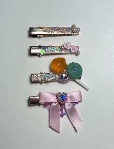 ✨ Kawaii Candy Hair Clips | Cute Fairy Kei Pastel Barrettes | Mix & Match Custom Hair Clip Set. This listing is for either a single clip or a custom set based on availability. Each piece is made with a combination of epoxy resin and polymer clay embellishments as well as satin bows. ✨Each item is hand made and adhered one piece at a time. Although I use my own version of forever glue these should be handled with care to avoid damage.  These items are made up of small parts that could be a choking hazard if item is damaged. ✨ 1.5 inch (3.81cm)  ✨Shipping & Delivery ~ Your order is made and ready to ship in 1-3 business days ~ Packages are typically shipped via USPS ✨KEEP SHOPPING  Return to my main shop here:  https://www.etsy.com/shop/LemonPopLolita Find similar items here: https://www.ets Candy Hair Clips, Diy Hairclips, Clay Hair Clips, Clay Embellishments, Pastel Fairy, Hair Clips Cute, Kawaii Candy, Resin And Polymer Clay, Candy Hair