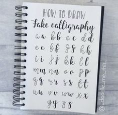 a spiral notebook with the words how to draw in cursive writing on it