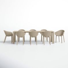 a group of chairs sitting around a table with one chair facing the camera and four behind it