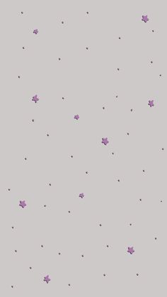 purple confetti falling down into the air on a gray background