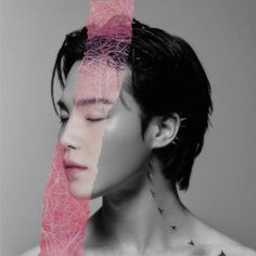 a man with his face covered in pink thread