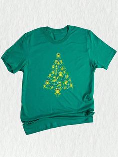 Get in the festive spirit with this delightful Christmas Frog Tree T-Shirt! It's the perfect gift for anyone who loves frogs and Christmas! Spread holiday cheer and make a statement with this unique and colorful Christmas Spirit Shirt. Whether worn as a casual everyday outfit or as part of a Christmas costume, this Christmas Frog Tree T-Shirt is sure to bring joy and laughter throughout the holiday season!Christmas Frog Tree T-Shirt, Funny Frog Christmas Tee, Christmas Tree Gift, Christmas Spirit Shirt, Christmas Costume Kelly Green Casual  Short Sleeve  Animal,Cartoon,Christmas,Colorblock,Figure,Geometric,Graphic,Letter,Striped,Plants,Textured Pattern    Women Clothing, size features are:Bust: ,Length: ,Sleeve Length: Frog Christmas, Christmas Frog, Christmas Spread, Plant Texture, Christmas Tree Gift, Cartoon Christmas, Funny Frogs, Christmas Costume, Spirit Shirts