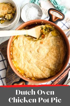 a pot pie with a wooden spoon in it