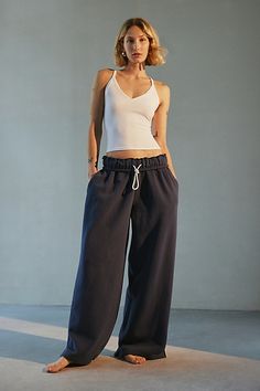 Out From Under sweatpant made special with piping details. Designed in a relaxed wide-leg silhouette featuring a ruffled elastic waistband with drawstring tie, side pockets and split hems. Exclusively at Urban Outfitters. Features Out From Under Hoxton piping wide leg sweatpant Wide leg sweatpant Soft and stretchy knit Ruffled elastic waistline with drawstring tie Side pockets with contrast piping down the sides Split hems Relaxed wide-leg fit Full length Easy pull-on style UO exclusive Content + Care 69% Cotton, 31% polyester Machine wash Imported Size + Fit Model in Ivory is 5’8" and wearing size Small Measurements taken from size small Inseam: 30" | Out From Under Hoxton Piping Sweatpant in Navy, Women's at Urban Outfitters Wide Leg Sweatpants Outfit, Sweats Aesthetic, Urban Outfitters Sweatpants, Sweatpants Aesthetic, Cute Sweats, Sweatpants Outfit, Wide Leg Sweatpants, Contrast Piping, Sweat Pants