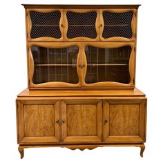 an old fashioned wooden china cabinet with glass doors and drawers on one side, in the shape of a bookcase