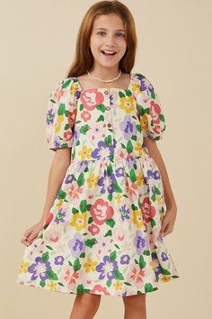 Let your little fashionista blossom in our Girls' Square Neck Dress! Featuring a playful floral print fabric and a trendy square cut neckline, this dress will have her twirling with joy. The puff sleeves add a touch of whimsy to this must-have dress. Perfect for any occasion! Girls' floral dress with square neckline and button details. Cute Square Neck Floral Dress For Garden Party, Cute Floral Square Neck Dress For Garden Party, Cute Square Neck Puff Sleeve Dress For Garden Party, Cute Floral Print Dress With Puff Sleeves, Cute Floral Print Dress With Square Neck, Puff Sleeve Playtime Dress For Spring, Spring Puff Sleeve Playtime Dress, Spring Playtime Puff Sleeve Dress, Cute Floral Print Dress For Playdate