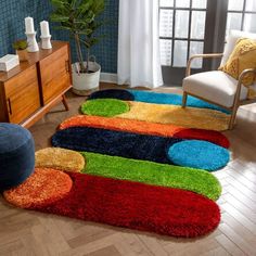 a living room area with rugs on the floor