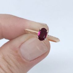 SOLID 14K GOLD Natural Ruby Gemstone / Genuine Ruby Stone / Ruby Engagement Ring Gold / July Birthstone / Engagement Ring Gold/Gift For Her Solid 14K Gold ring set with a natural ruby stone . This dainty and stackable ring features a natural ruby gemstone. This is our July birthstone and is available in 14k solid white gold, yellow gold and rose gold. Perfect for everyday wear or stacking with others for a Mother's Ring set. PRODUCT DETAILS Made to order. Gold : Solid 14K Gold Choice of Gold: Ro 14k Rose Gold Jewelry With Accent Stones, Birthstone Ring In 14k Rose Gold With Gemstone, 14k Rose Gold Birthstone Ring With Gemstone, Oval Ruby Ring With Gemstone Accents In 14k Gold, 14k Rose Gold Birthstone Ring With Yellow Gold Gemstone, Oval Ruby Ring In 14k Rose Gold, 14k Yellow Gold Ruby Ring With Gemstone Accents, Ruby Engagement Ring Gold, Asymmetrical Ring