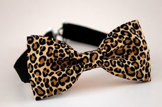 This trendy and stylish bow tie is great for so many occasions!Bow tie made of 100% cotton with a matching, adjustable neck strap. Style:• The Pre-Tied Bow Tie• The Clip-On Bow TieAll our bow ties can be made in the following sizes, just specify which size you need in a note at checkout: Sizes:Baby: 3.5" x 2"Kids: 4" x 2"Youth: 4.25" x 2.25Adult: 5" x 2.5"All our bow ties are made by hand; therefore, measurements are a guideline only and cannot be guaranteed. Neck strap sizes:Baby – adjustable t Animal Print Accessories, Satin Bow Tie As Summer Gift, Summer Black Tie Butterfly Knot Bow Tie, Brown Bow Tie For Party, Brown Dapper Bow Tie For Party, Dapper Brown Bow Tie For Party, Brown Summer Bow Tie, Summer Bow Tie Back Ties As Gift, Summer Bow Tie Back Tie As A Gift