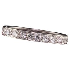 Beautiful Antique Art Deco Platinum Single Cut Diamond Eternity Band - Size 7. This incredible ring is crafted in platinum. There are single cut diamonds going around the entire ring and it is in great condition. Item #R1413 Metal: Platinum Weight: 3 Grams Size: 7 Diamonds: Approximately 1 cts Color: H Clarity: VS2 Measurements: Top of the ring measures 3 mm wide and band measures 3 mm wide. Measurements off the finger: 2.21 mm high Layaway: For your convenience, we will be happy to provide laya Eternity Band Diamond, Antique Art Deco, Diamond Eternity, Cool Suits, Eternity Bands, Diamond Bracelet, Platinum, Diamond Cuts, Jewelry Rings