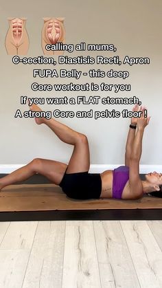 a woman laying on top of a yoga mat in front of a wall with words above her