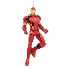 a red and yellow iron man ornament hanging from a string on a white background