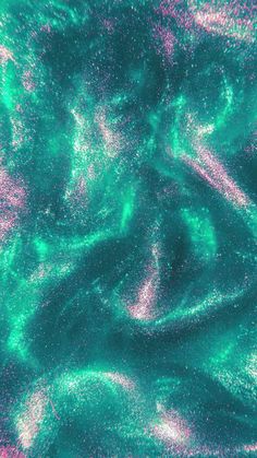 green and pink paint is seen in this aerial view from space, with the earth's surface visible