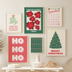 a white table topped with lots of pictures and christmas decorations next to a vase filled with flowers